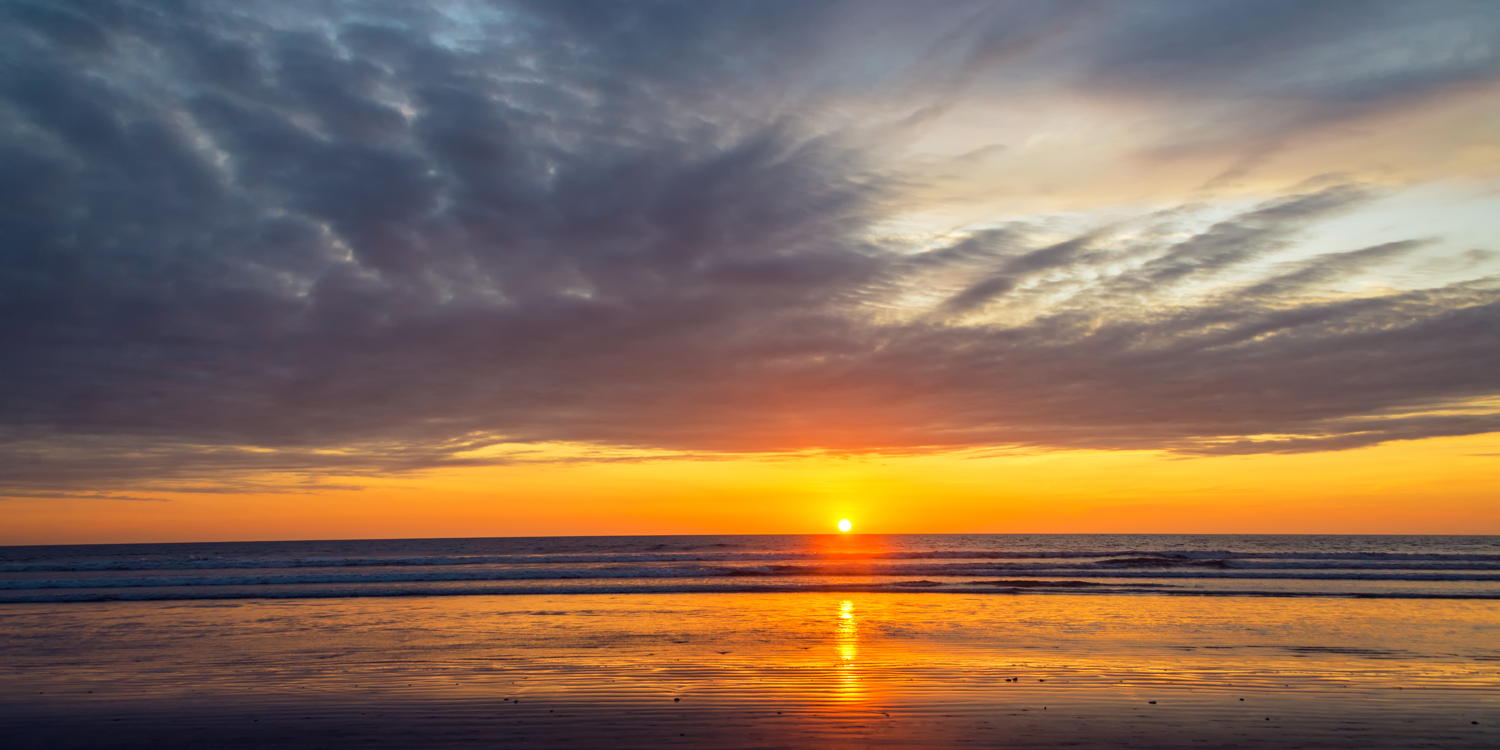 Sunset over the beach at Olon Ecuador